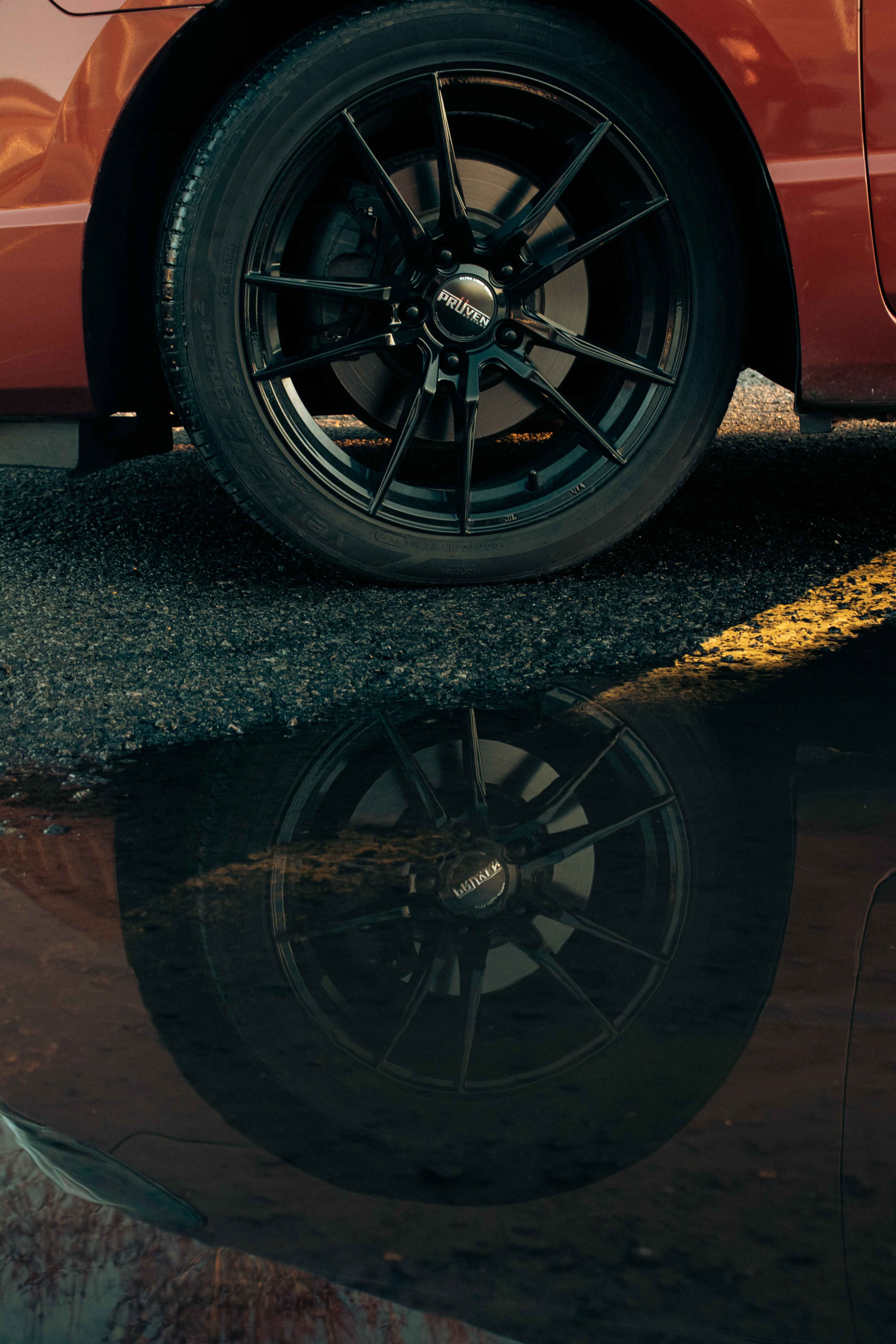 Car wheel with water reflection